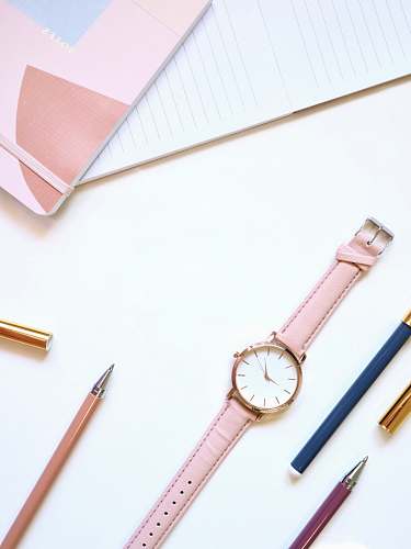 pencil round gold-colored analog watch simple